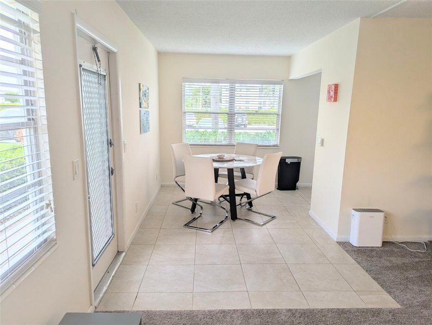 Bright ground-floor corner unit, partially furnished, featuring - photo 11