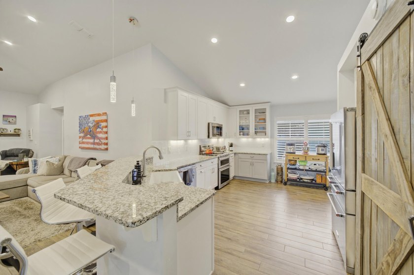 Welcome to this beautifully upgraded coastal retreat in the - photo 5