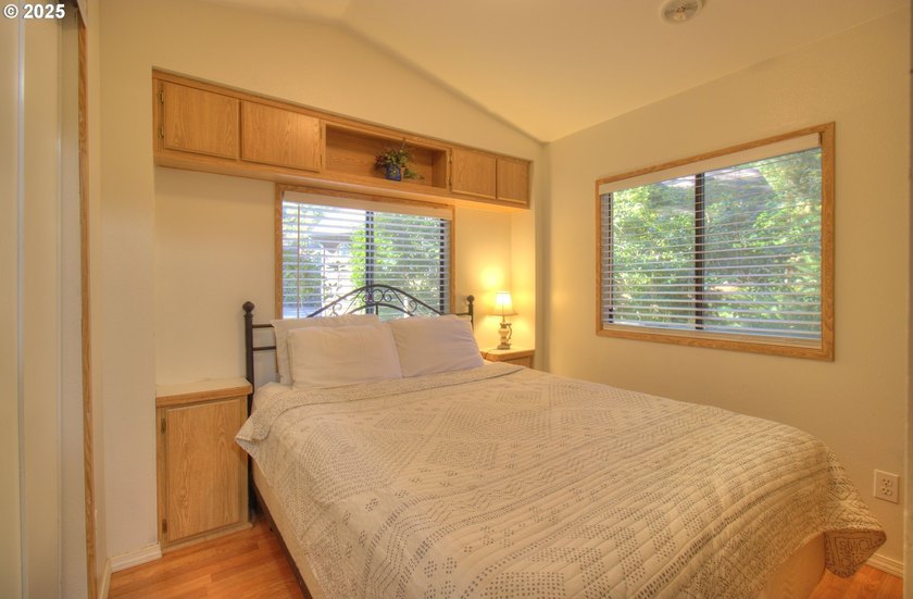 Tucked into a serene wooded setting alongside a peaceful creek - photo 12
