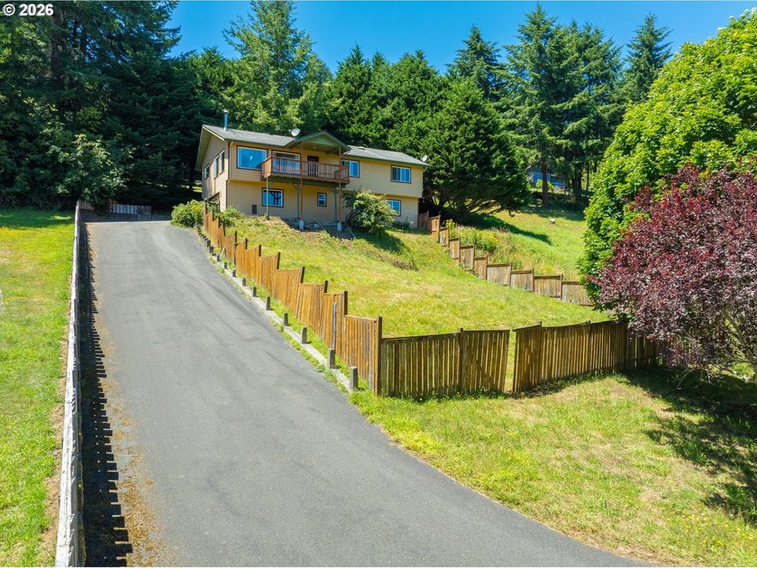 Nestled on over half an acre, this versatile 2-story home offers - photo 2