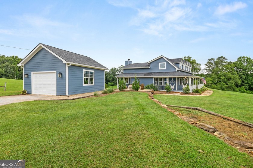 A beautifully remodeled farmhouse situated on 13.39 private - photo 3