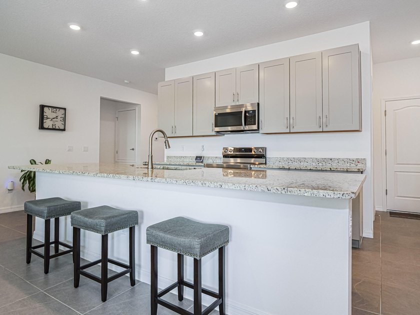 LIKE NEW beautiful 2022 built concrete block home located in the - photo 13