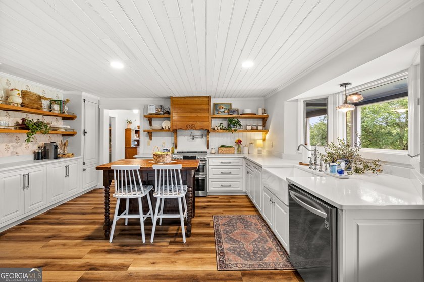 A beautifully remodeled farmhouse situated on 13.39 private - photo 8