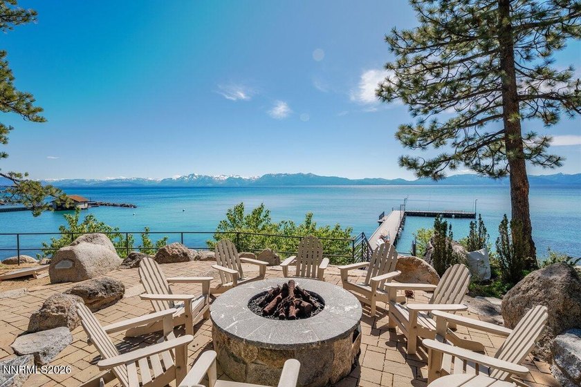 Nestled within the private, gated, waterfront community of - photo 3