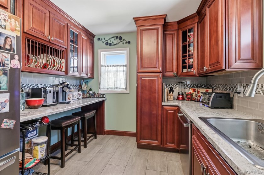 A Barnum Island beauty. This 3 Bdrm 2 Full Bath dormered raised - photo 9