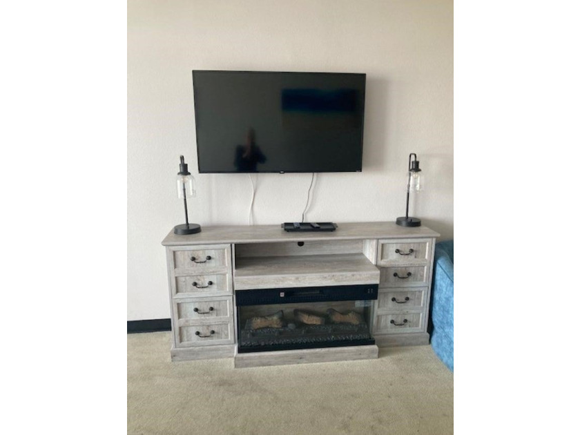 Carpet and wood floors; king bed and large sofa. Updated unit - photo 5