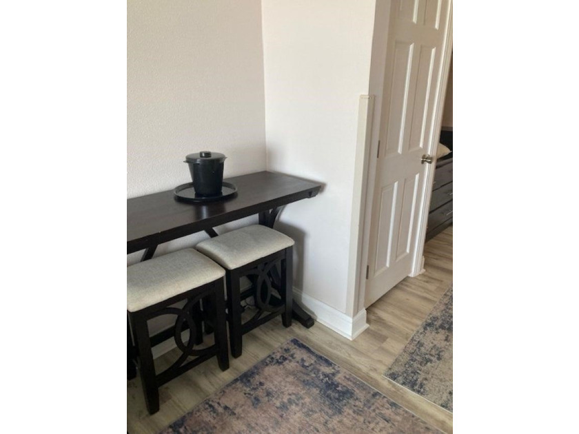 Carpet and wood floors; king bed and large sofa. Updated unit - photo 6