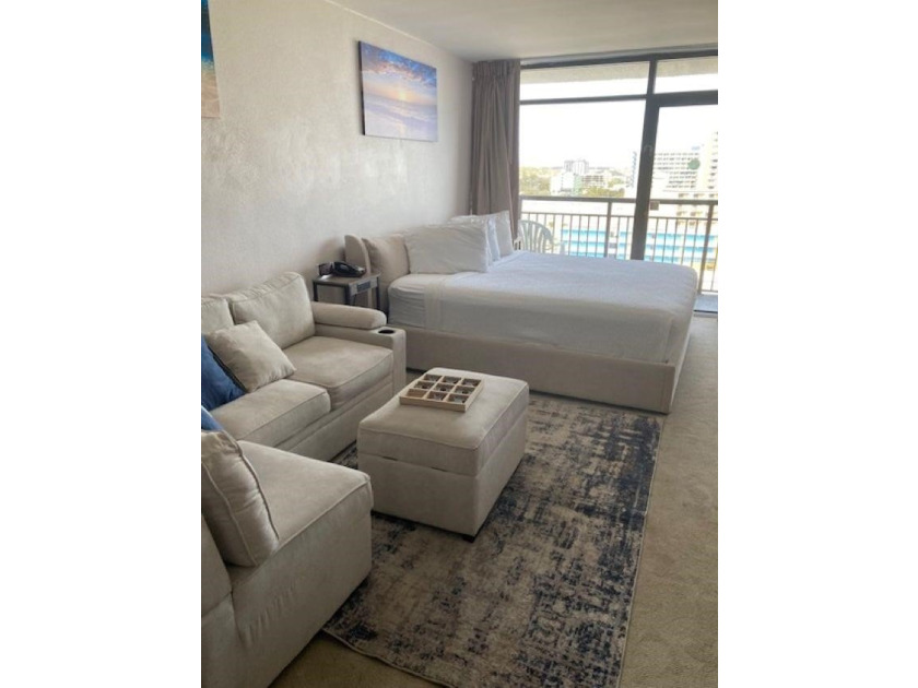 Carpet and wood floors; king bed and large sofa. Updated unit - photo 7
