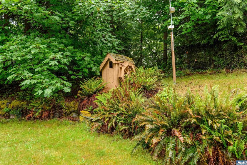 Welcome to this spacious 4-bedroom, 2.5-bath home on 5 peaceful - photo 45