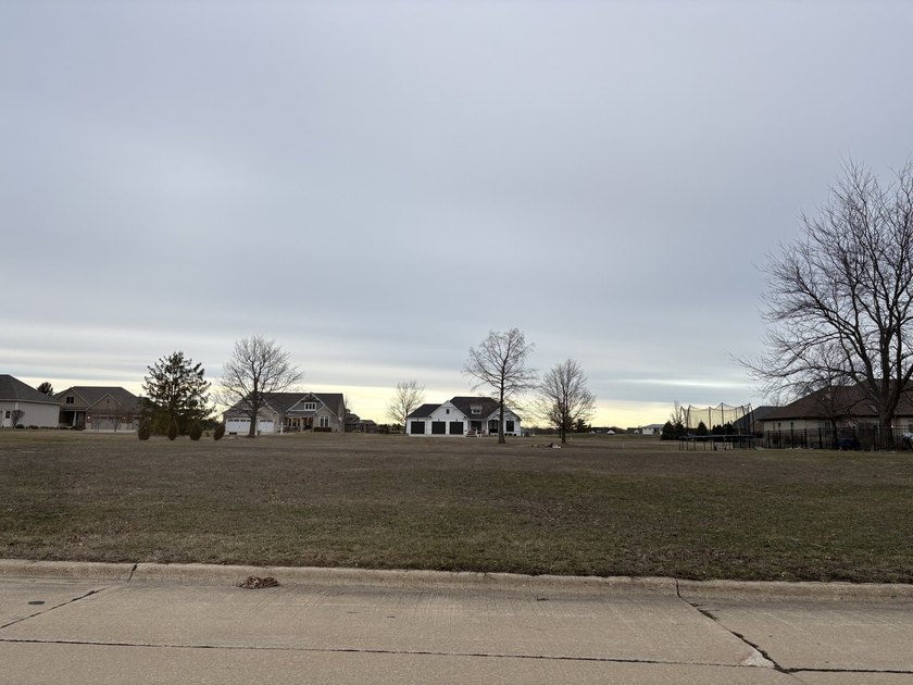 Build your dream home on this nearly half-acre vacant lot in the - photo 3