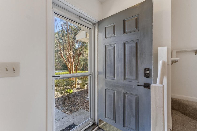 Nestled in a quiet, tucked-away neighborhood within the highly - photo 4