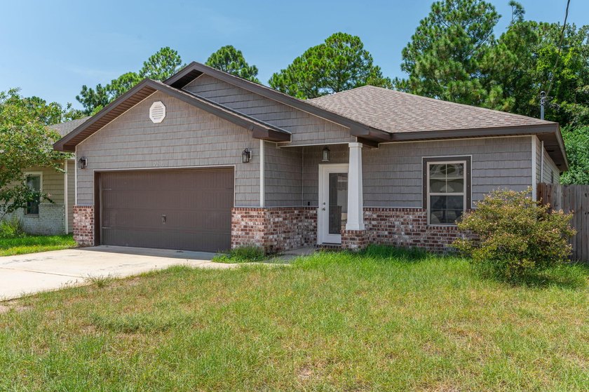 As you step inside, you are greeted with an open floor plan that - photo 2