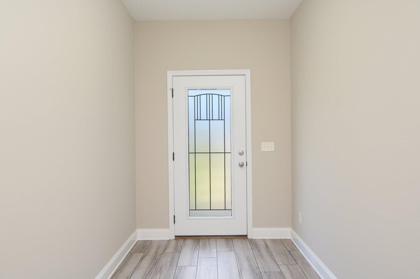 As you step inside, you are greeted with an open floor plan that - photo 5
