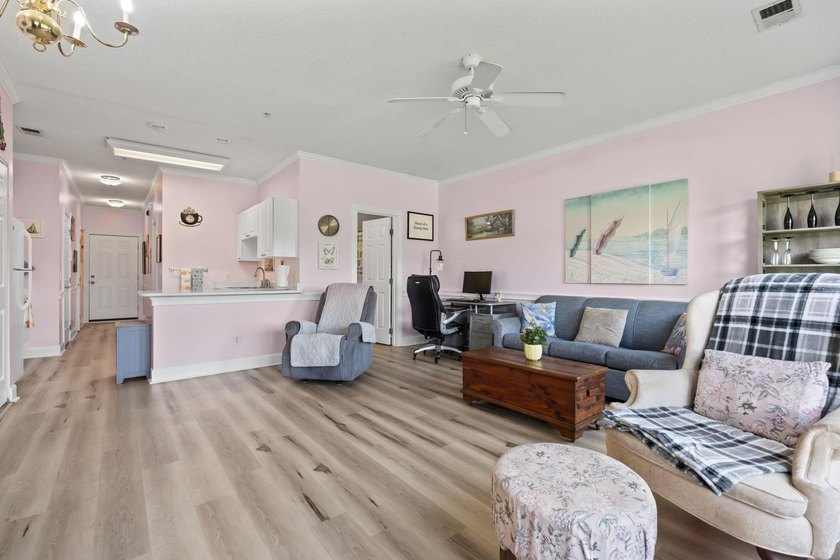 This stunning second-floor 1-bedroom, 1.5-bath condo offers - photo 3