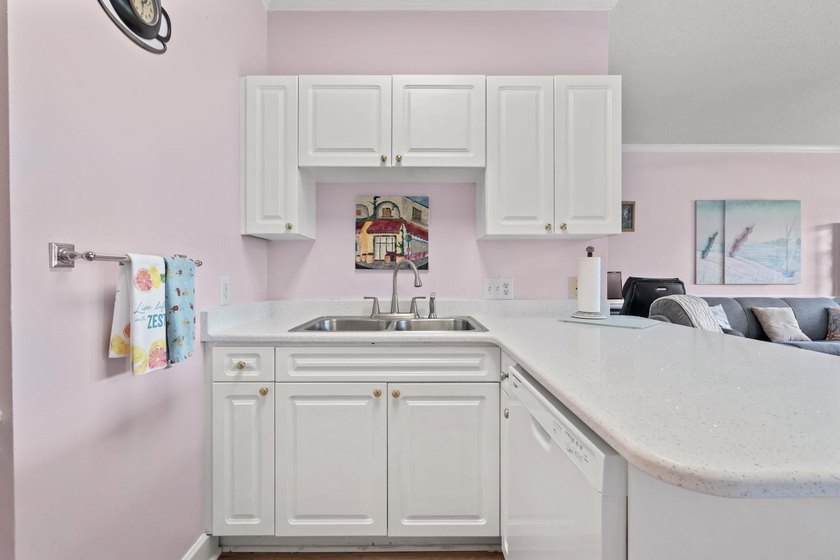 This stunning second-floor 1-bedroom, 1.5-bath condo offers - photo 10