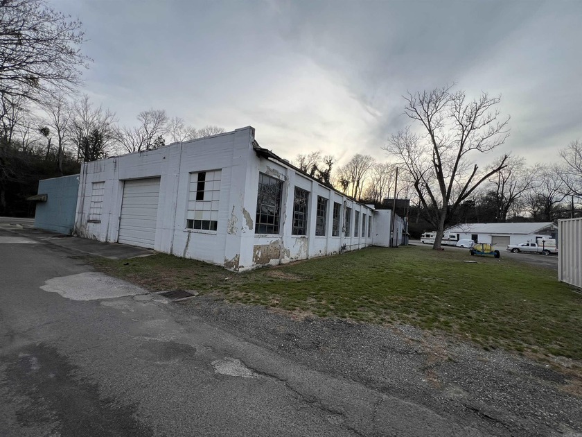 This former Chevrolet Dealership includes: three bathrooms, six - photo 4
