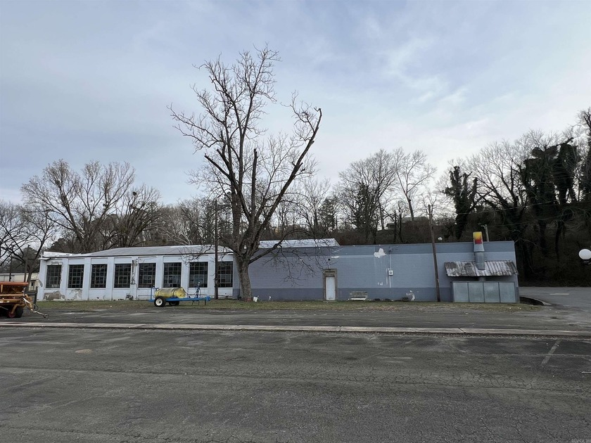 This former Chevrolet Dealership includes: three bathrooms, six - photo 5