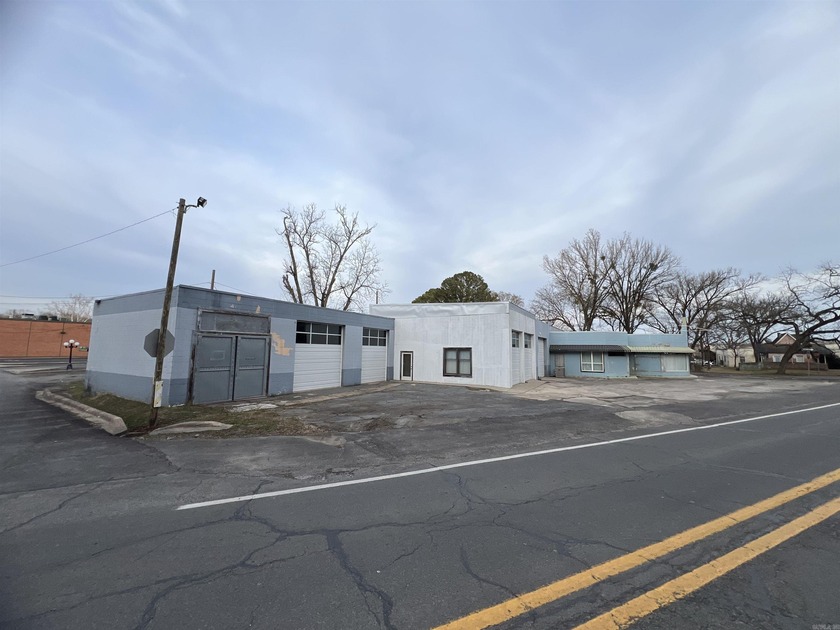 This former Chevrolet Dealership includes: three bathrooms, six - photo 8