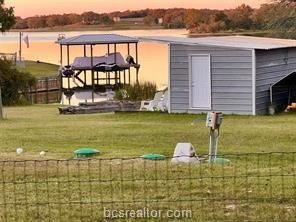 Come take a look at this waterfront lot. Has a small cabin - photo 5