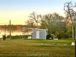 Come take a look at this waterfront lot. Has a small cabin - photo 6