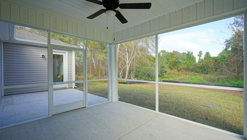 *4 bedrooms, 2.5 baths *Welcoming front porch and screened in - photo 2