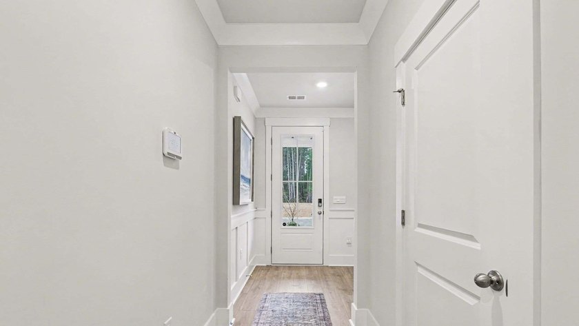 *4 bedrooms, 2.5 baths *Welcoming front porch and screened in - photo 3
