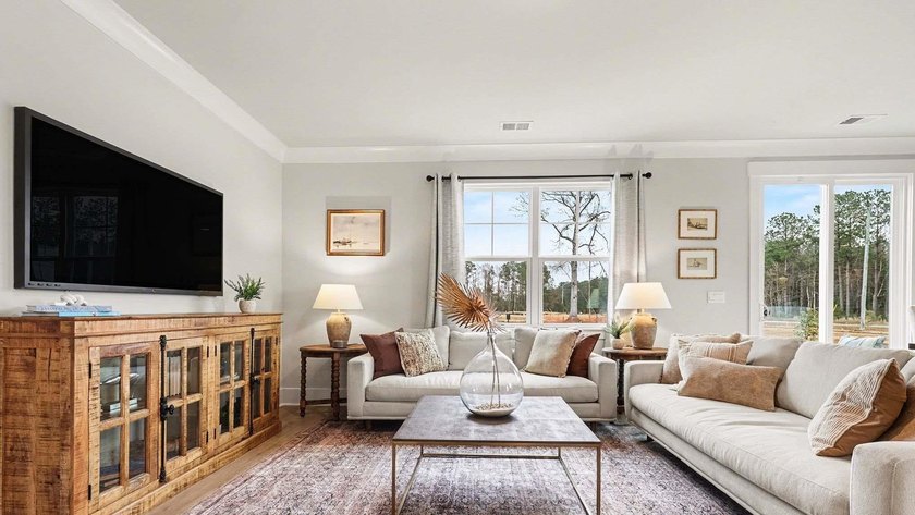 *4 bedrooms, 2.5 baths *Welcoming front porch and screened in - photo 4