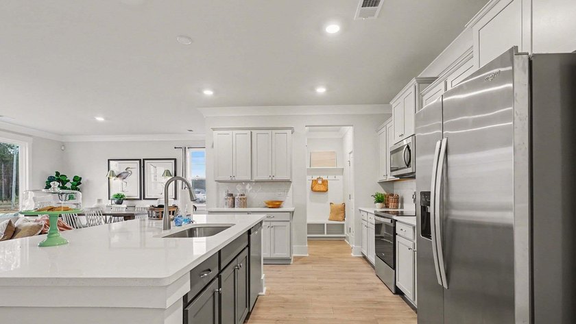 *4 bedrooms, 2.5 baths *Welcoming front porch and screened in - photo 9