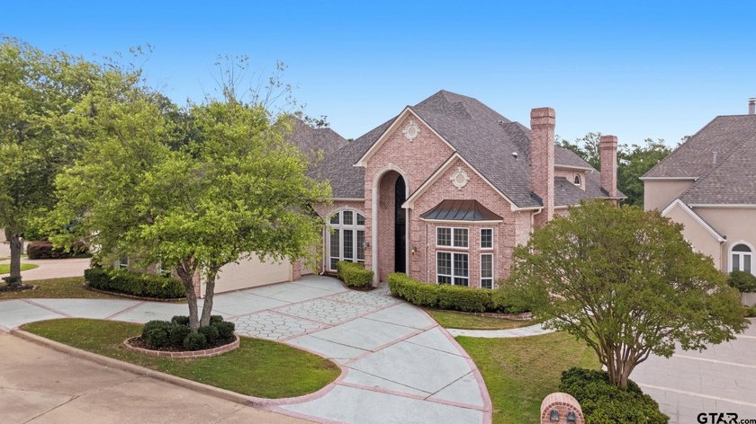 This extraordinary estate is located in the gated community of - photo 2