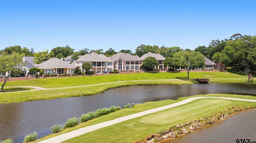 This extraordinary estate is located in the gated community of - photo 5