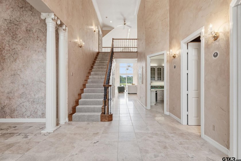 This extraordinary estate is located in the gated community of - photo 7