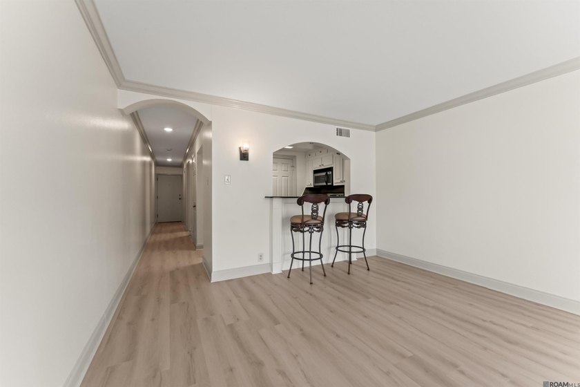 UNIT 105 - BEAUTIFUL FIRST FLOOR UNIT. DOWNTOWN LIVING AT ITS - photo 3
