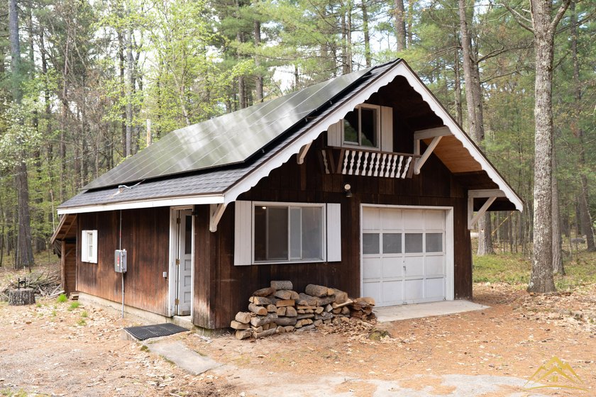 Tucked among the pines of Au Sable Acres, this fully furnished - photo 2