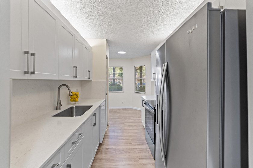 Beautifully renovated 2 BD, 2 BA first-floor condo in Century - photo 7