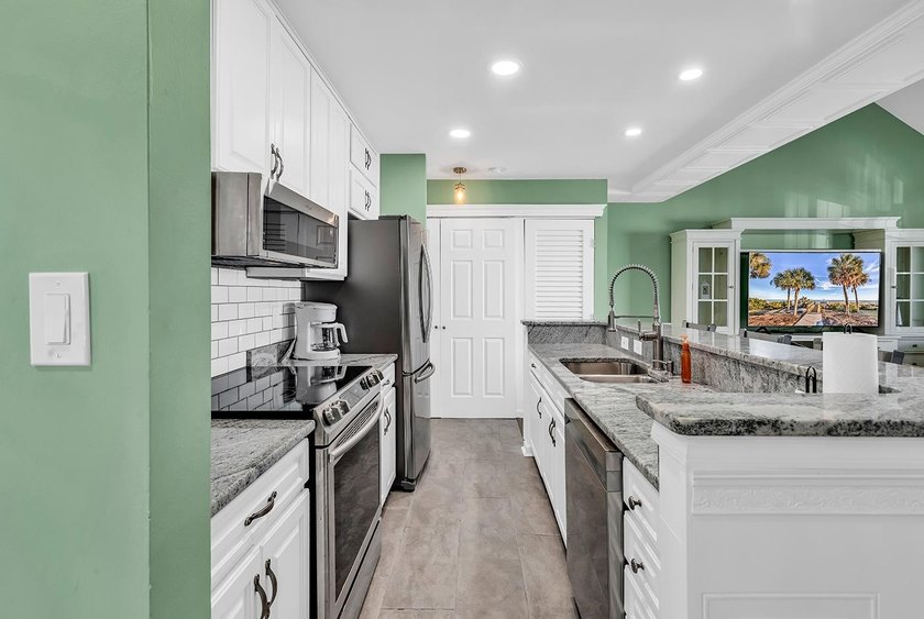 Welcome to this completely updated 2 bedroom 2 bath condo in the - photo 6