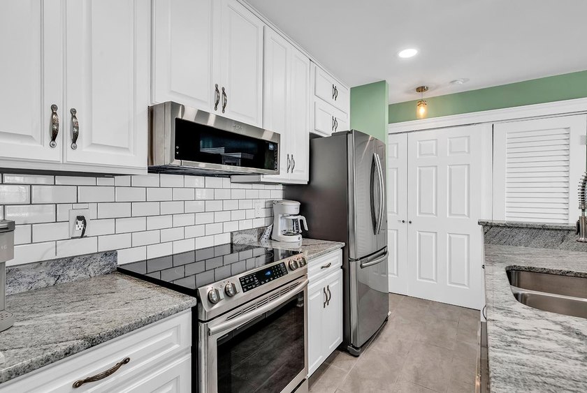 Welcome to this completely updated 2 bedroom 2 bath condo in the - photo 7