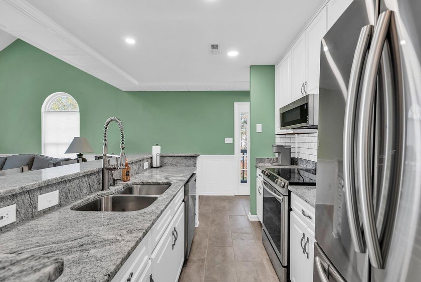 Welcome to this completely updated 2 bedroom 2 bath condo in the - photo 9