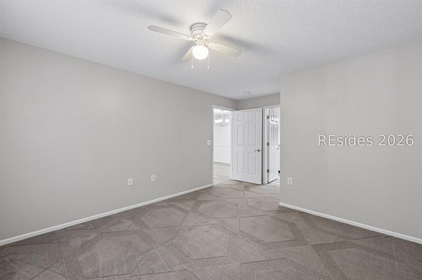 Enjoy wooded views from this second-floor condominium in The - photo 11