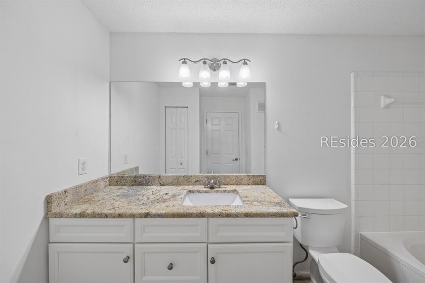 Enjoy wooded views from this second-floor condominium in The - photo 13