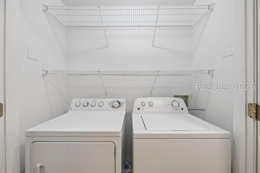 Enjoy wooded views from this second-floor condominium in The - photo 15
