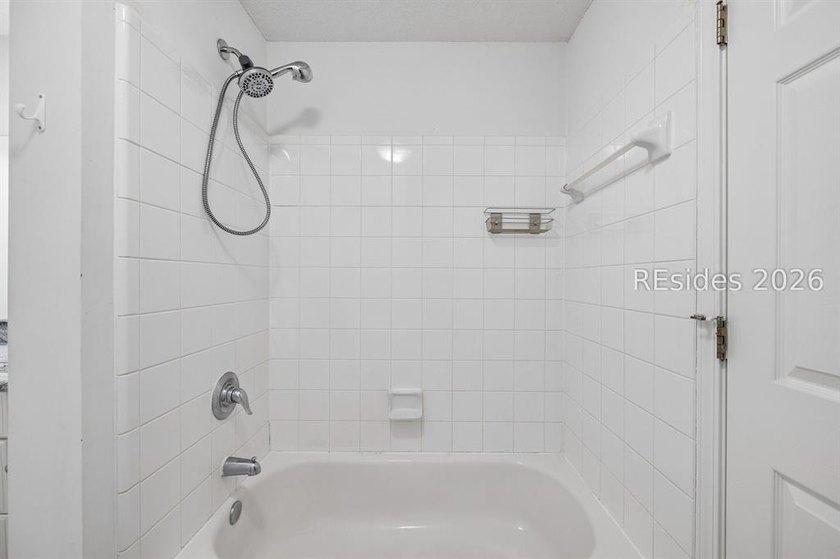 Enjoy wooded views from this second-floor condominium in The - photo 19