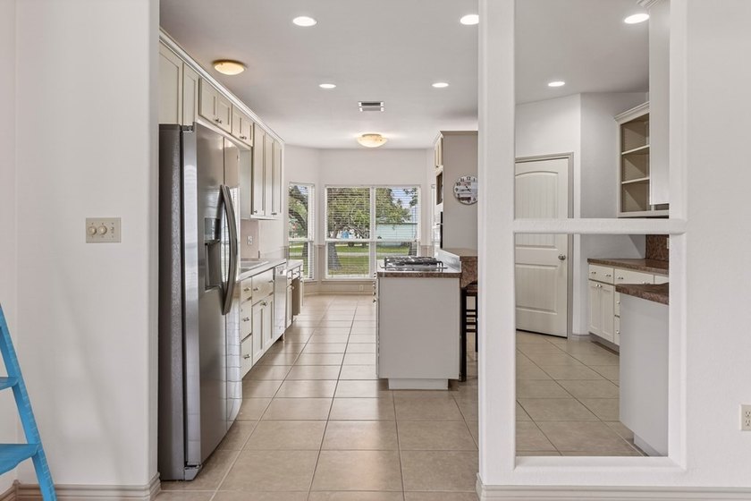 Nestled on a nicely landscaped spacious .66-acre corner lot in - photo 13