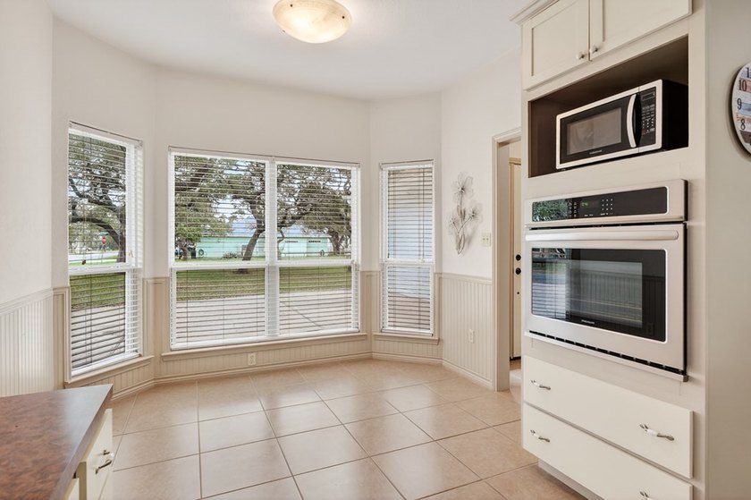 Nestled on a nicely landscaped spacious .66-acre corner lot in - photo 17