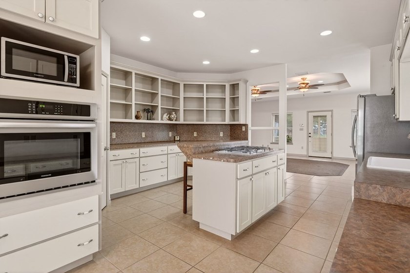 Nestled on a nicely landscaped spacious .66-acre corner lot in - photo 18