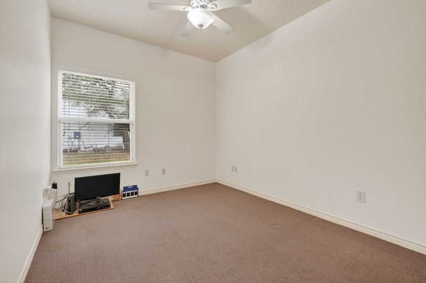 Nestled on a nicely landscaped spacious .66-acre corner lot in - photo 24