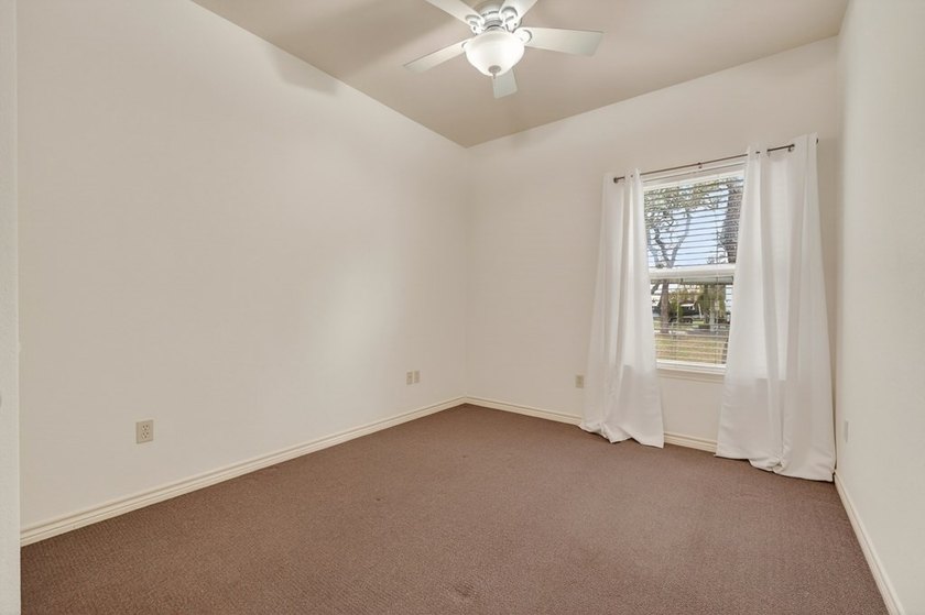 Nestled on a nicely landscaped spacious .66-acre corner lot in - photo 27