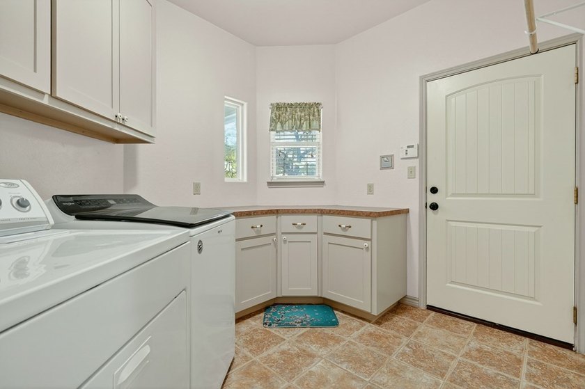 Nestled on a nicely landscaped spacious .66-acre corner lot in - photo 28