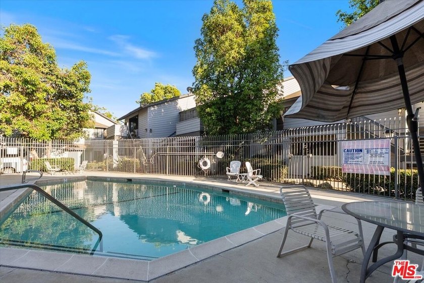 Welcome to this spacious two-story townhome-style condo in the - photo 11
