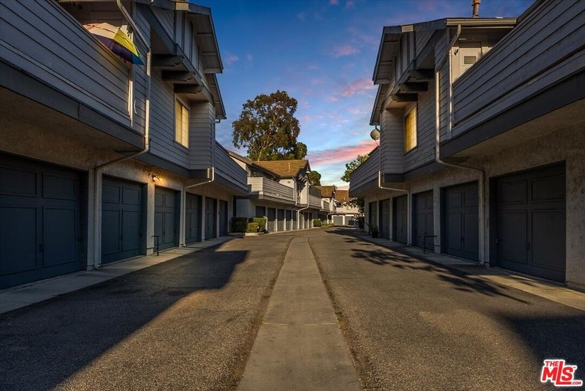 Welcome to this spacious two-story townhome-style condo in the - photo 12