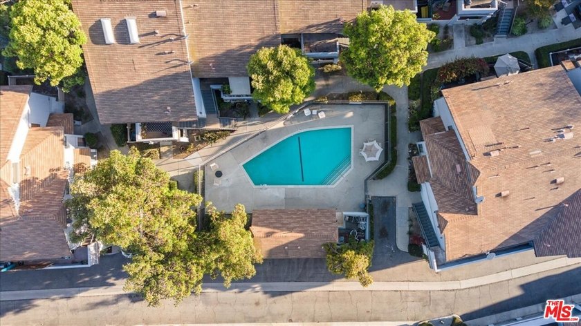Welcome to this spacious two-story townhome-style condo in the - photo 13